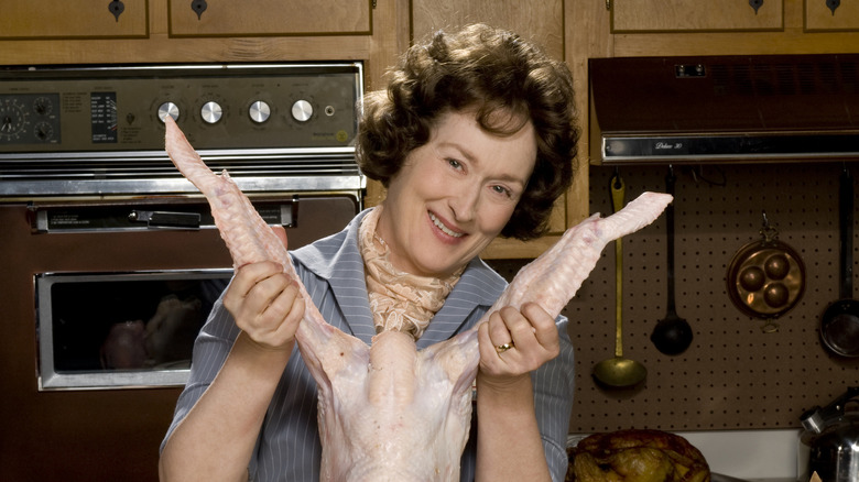 Julia holds chicken legs