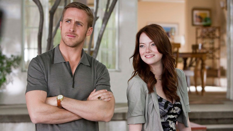 Jacob with his arms crossed next to Hannah in Crazy Stupid Love