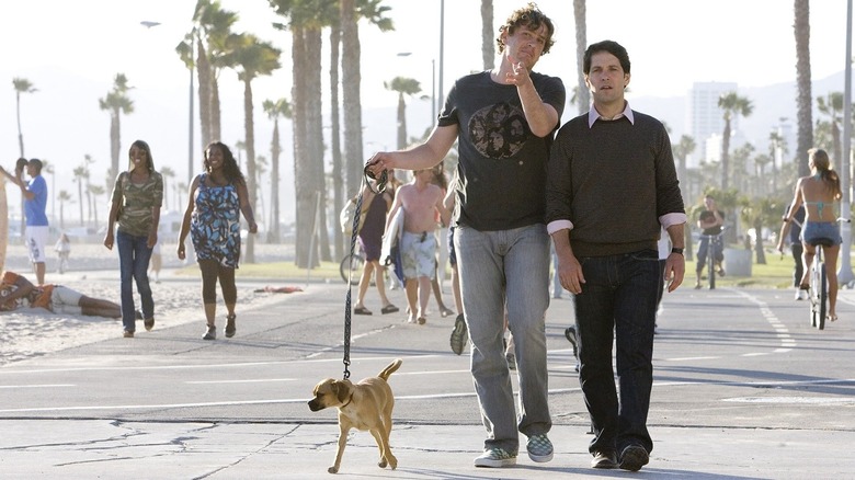 Sydney and Peter walking Anwar Sadat in I Love You, Man