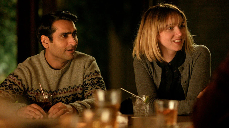 Kumail and Emily smiling at a bar in The Big Sick