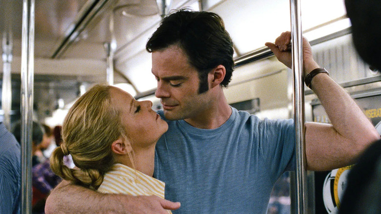 Amy and Aaron about to kiss on the subway in Trainwreck