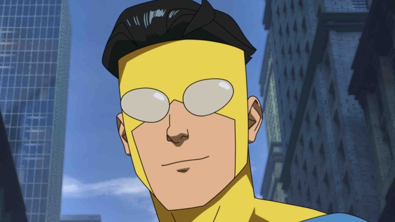 Invincible smiling in superhero costume