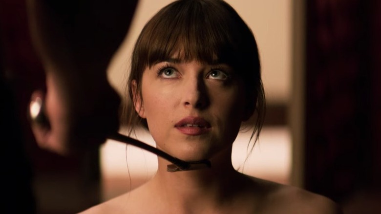Anastasia looks up at Christian in "Fifty Shades of Grey" (2015)