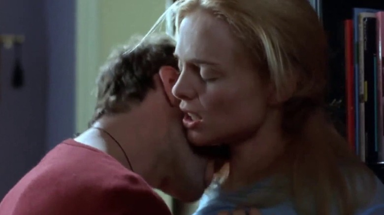 Adam pushes Alice against a bookshelf and licks her neck in "Killing Me Softly" (2002)