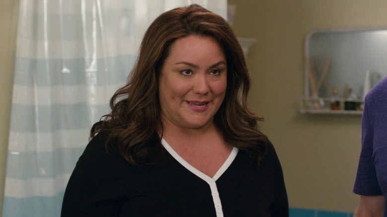 Katie standing in a bathroom in "American Housewife."