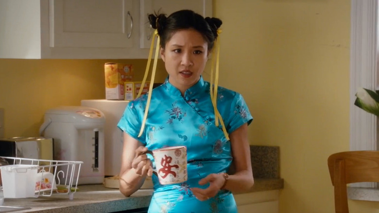 Jessica holding a mug in "Fresh Off the Boat."