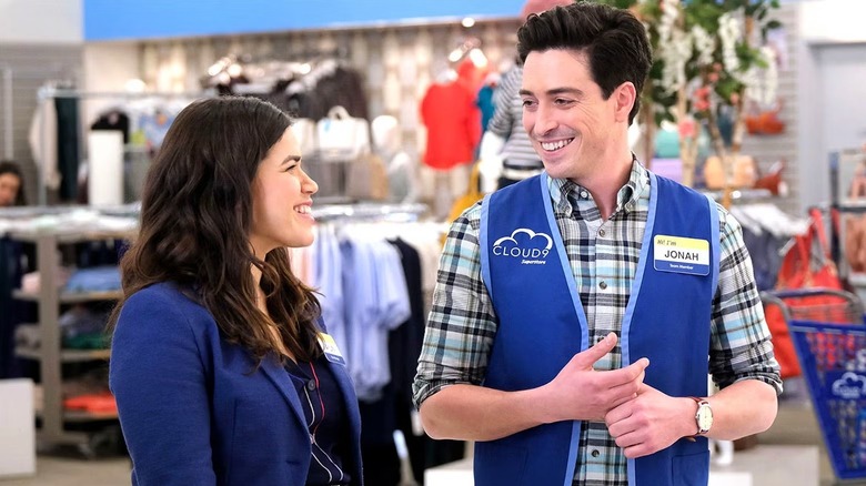 Amy and Jonah smiling at each other in "Superstore."