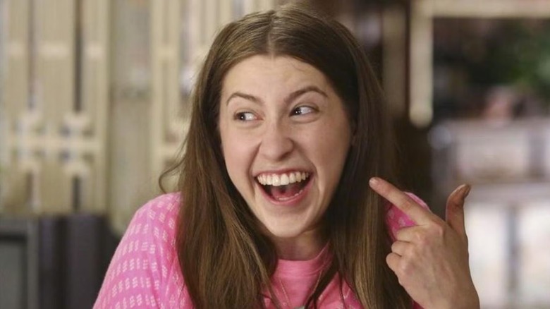 Sue pointing at her smile in "The Middle."