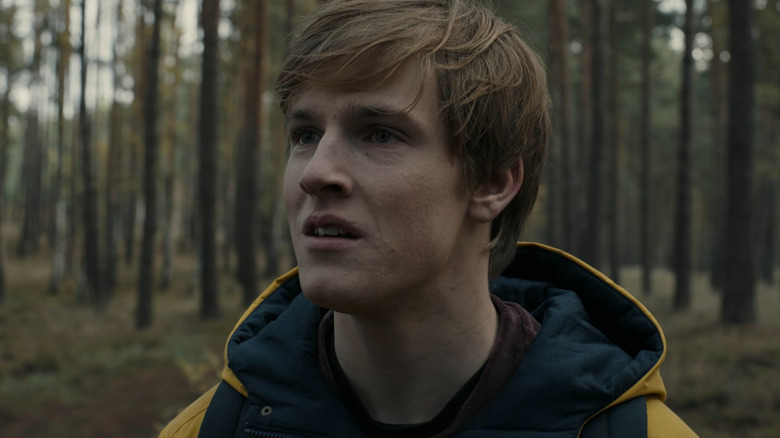 Jonas wearing a yellow raincoat on Dark