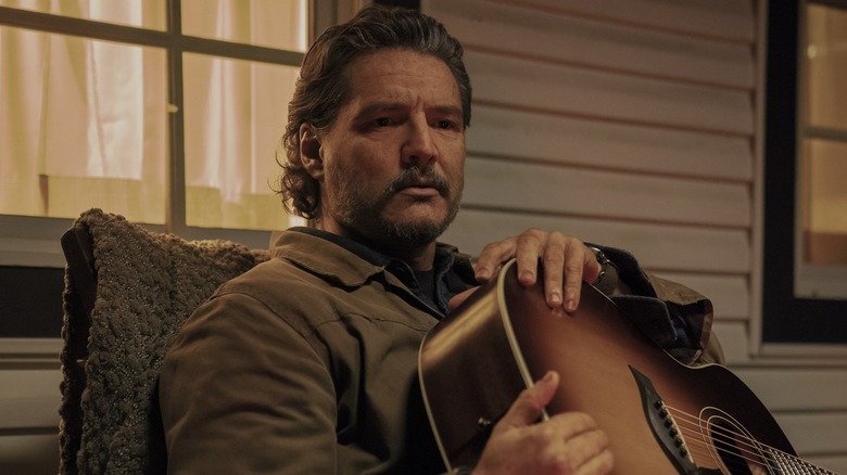 Joel with a guitar on The Last of Us