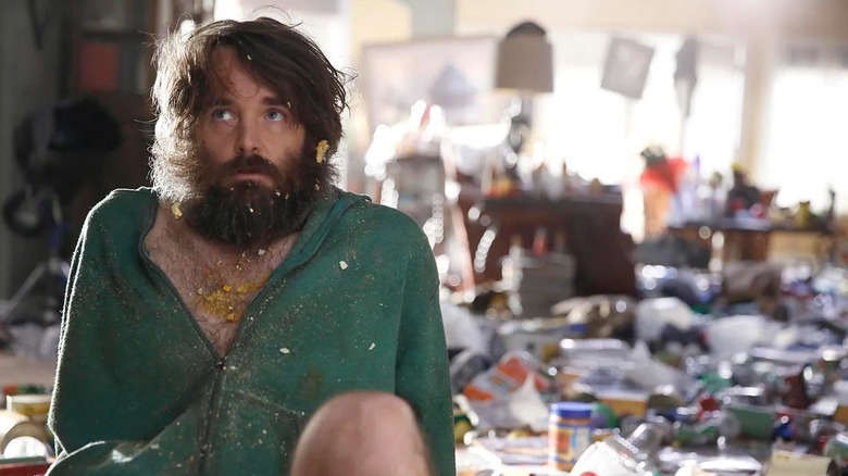 Phil Miller surrounded by trash in The Last Man on Earth