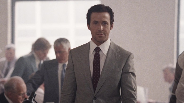 Jared Vennett walking among suited men
