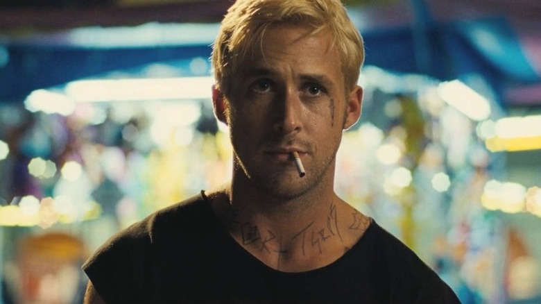 Luke wearing a vest and smoking a cigarette