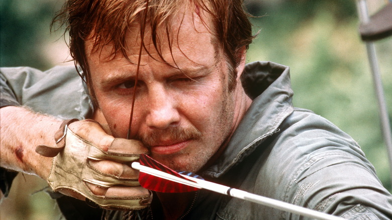 Jon Voight with a bow and arrow 