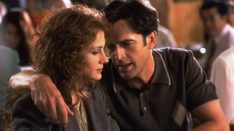 Julianne and George confer in "My Best Friend's Wedding"