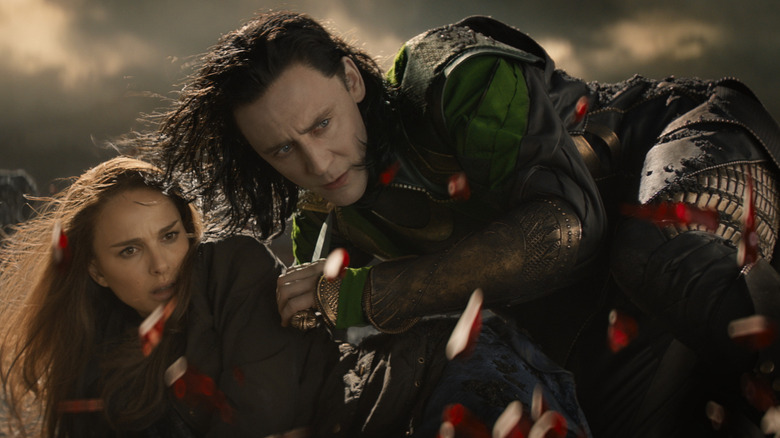 Loki and Jane cower in "Thor: the Dark World"