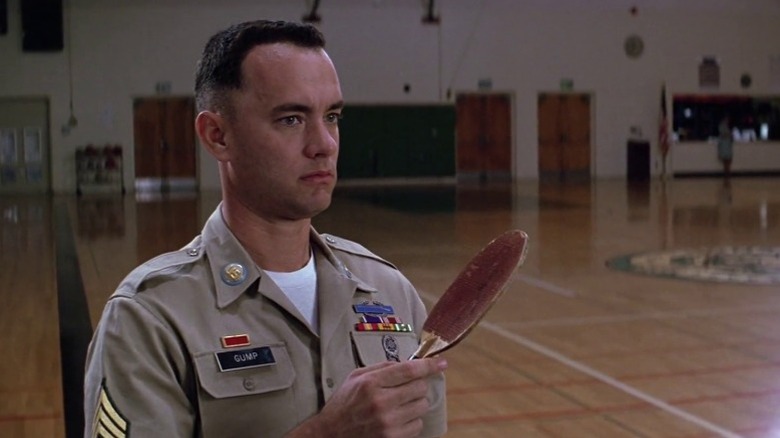 Forrest Gump holding a ping-pong paddle in Forrest Gump