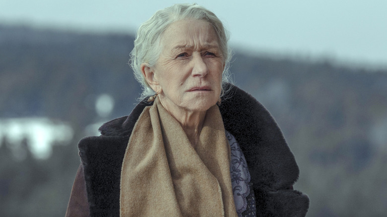 Cara Dutton wears a brown scarf