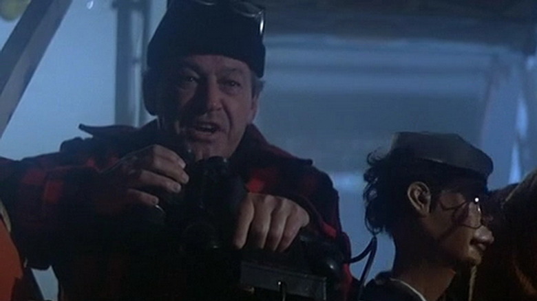 Murray Hamilton holding binoculars