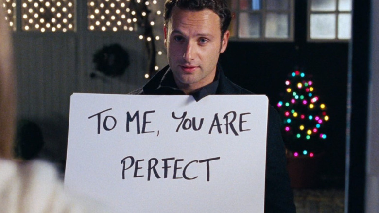 Mark holding a white cue card