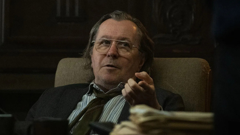 Jackson Lamb reclines in his chair while looking up at someone in his office in "Slow Horses"