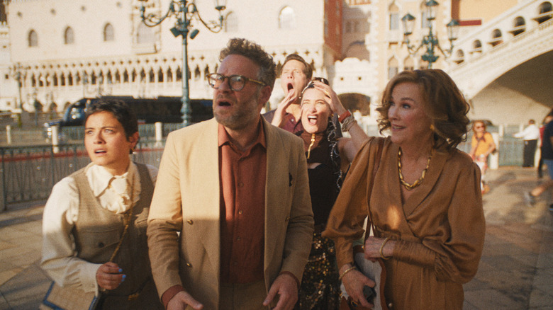 Matt Remick looks up in shock as the rest of his team stands behind him with looks of terror and Patty Leigh smiles on the streets of Las Vegas in "The Studio"