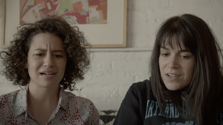 Abbi and Ilana sit on couch