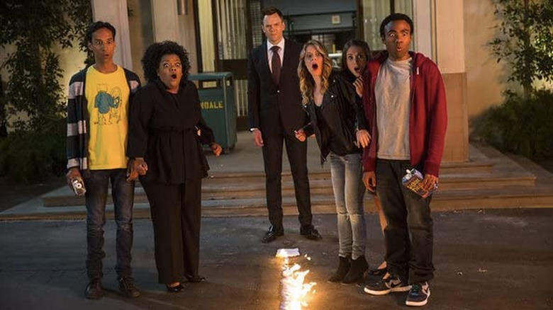 The cast of Community shocked outside school