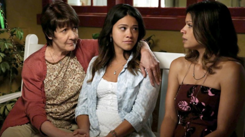 Jane sitting on the porch with her family