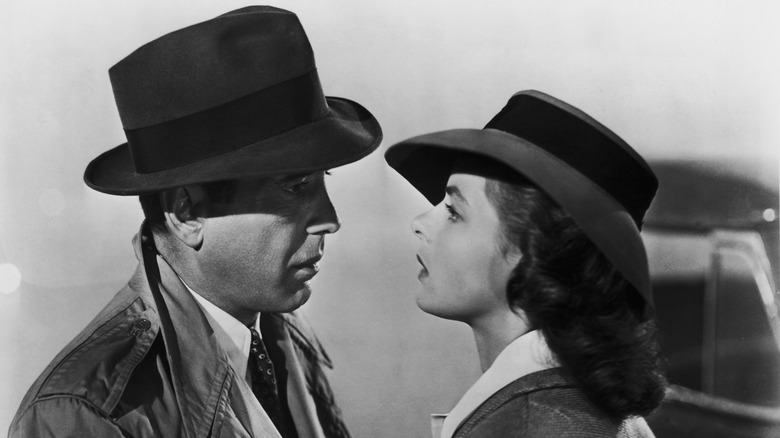 Rick and Ilsa speak close