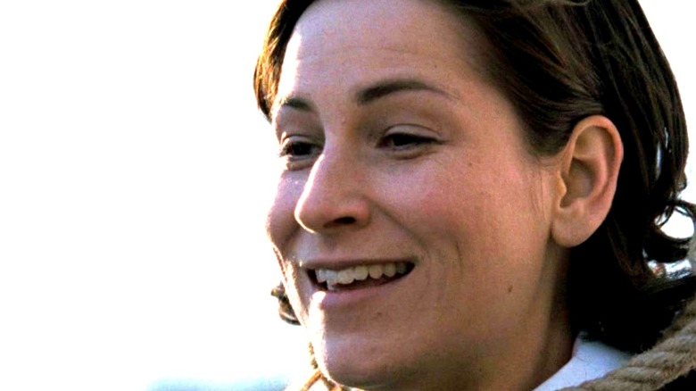 Damien's nanny stands with a noose around her neck