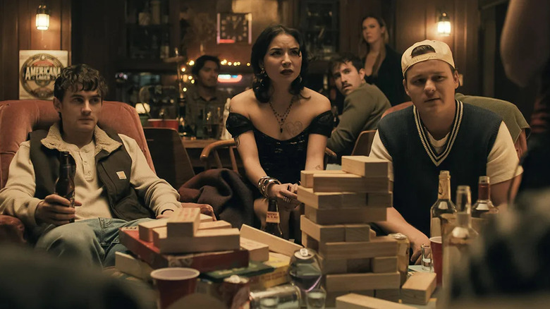 Bear, Sarah, and Ian at a party in "Obsession" (2027)