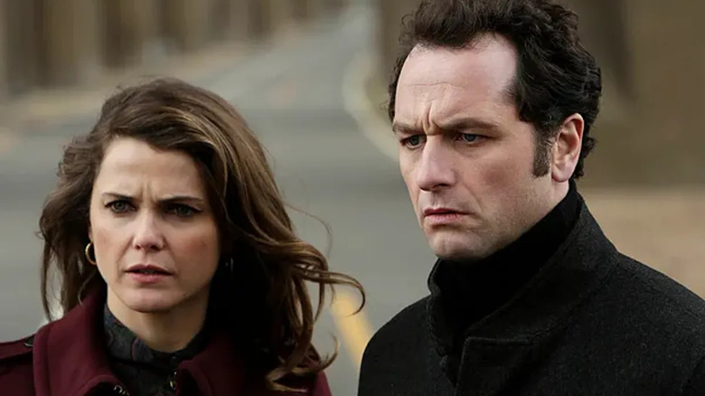 Elizabeth and Phillip look left