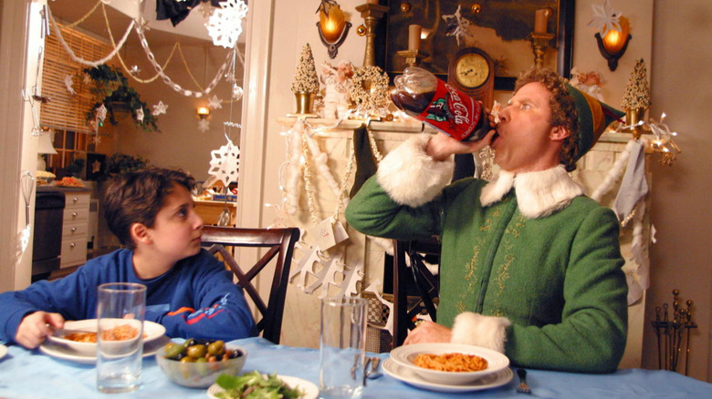Buddy chugging Coca-Cola in "Elf" (2003)