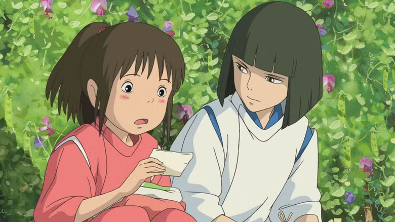 Haku watching Chihiro read a note in "Spirited Away" (2001)