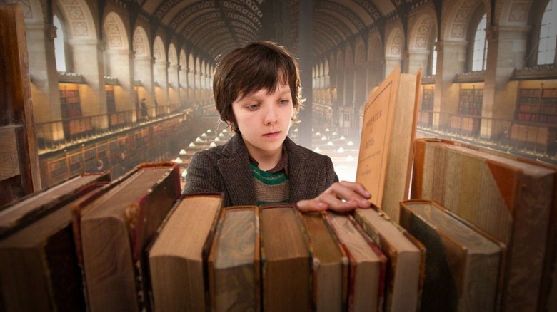 Hugo shelving a book in "Hugo."