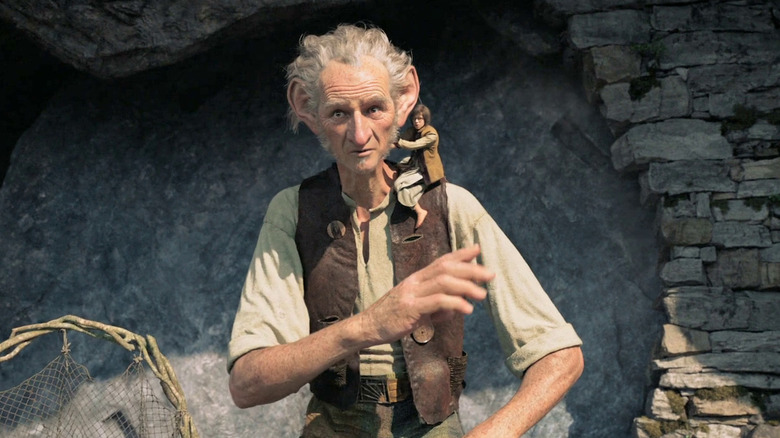 Sophie sitting on the BFG's shoulder in "The BFG."