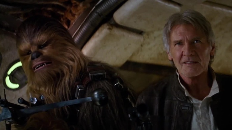 Chewbacca and Han Solo stand side by side in "Star Wars: The Force Awakens"