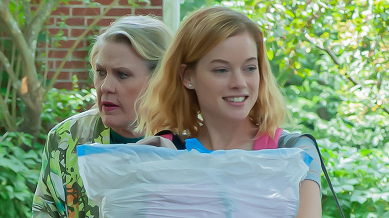 Tammy smiles as Venida frowns