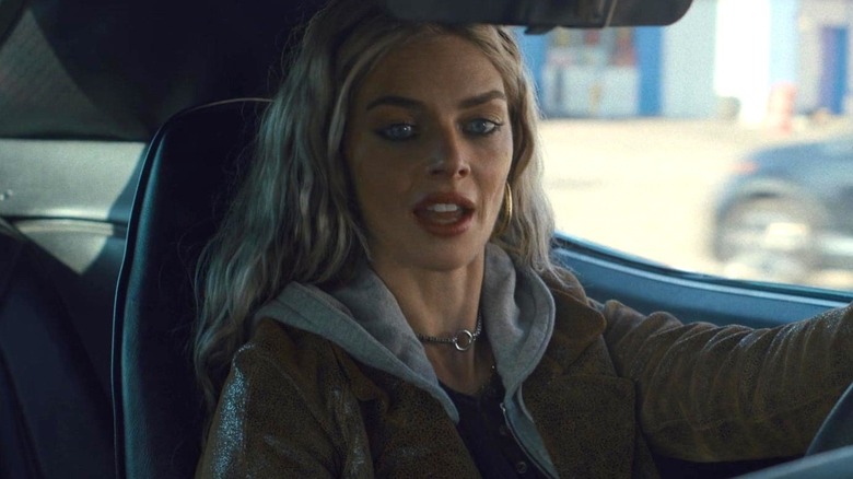 Edie Meaney driving a car in Eenie Meanie