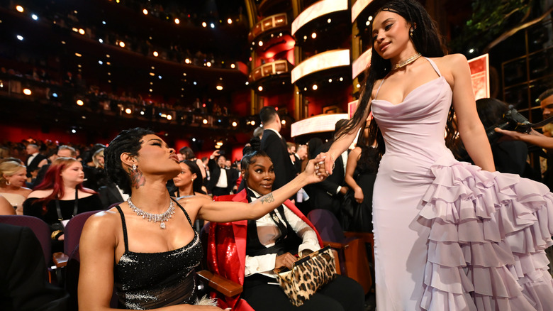 Teyana Taylor clutching hands with Chase Infiniti at the 98th Academy Awards (2026)
