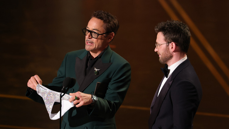 Robert Downey Jr. presenting Chris Evans with a glistening thong at the 98th Academy Awards (2026)