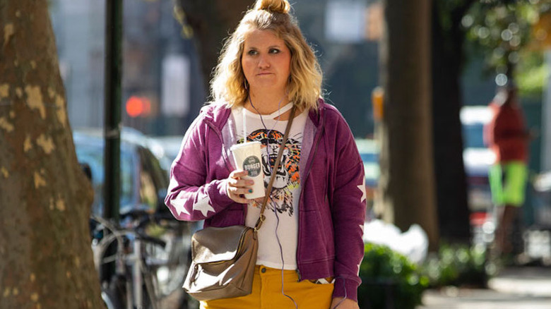 Brittany strolls with drink