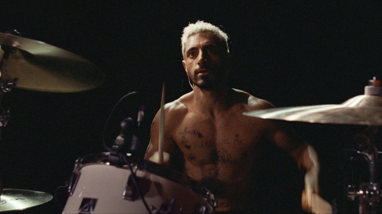 Riz Ahmed plays drums