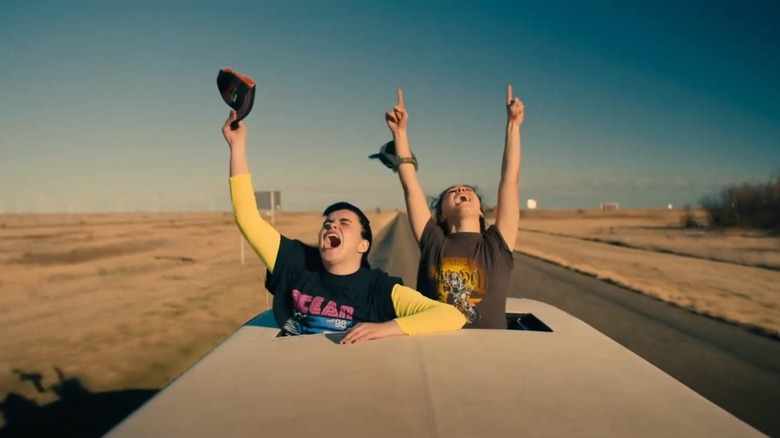 Teens hollering out sunroof