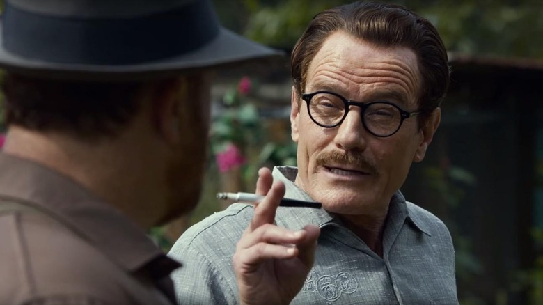 Trumbo holds a cigarette