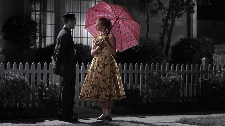 Tobey Maguire and Reese Witherspoon, looking at one another