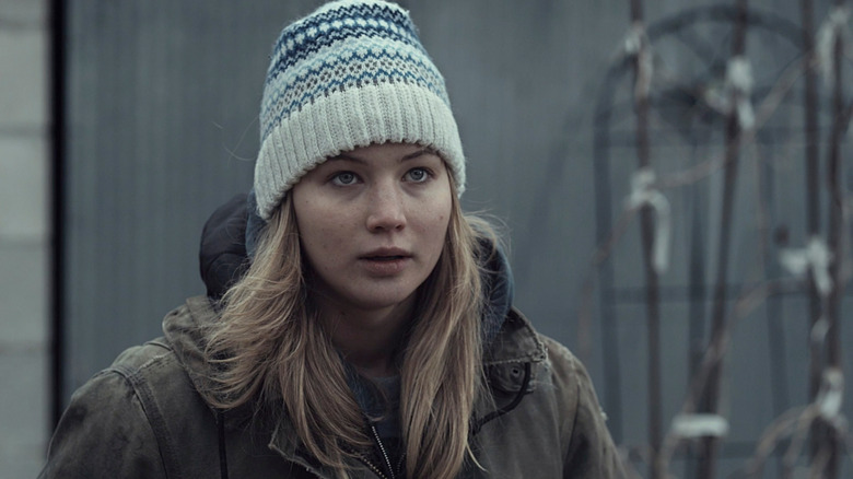Jennifer Lawrence looking up, wearing hat