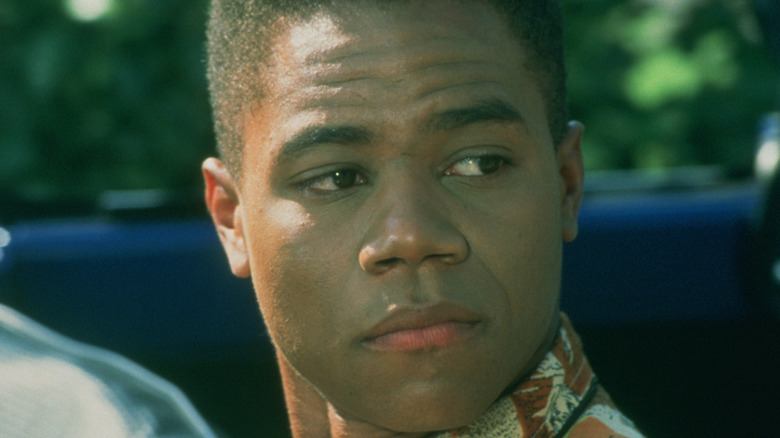 Cuba Gooding Jr. looks over shoulder from car