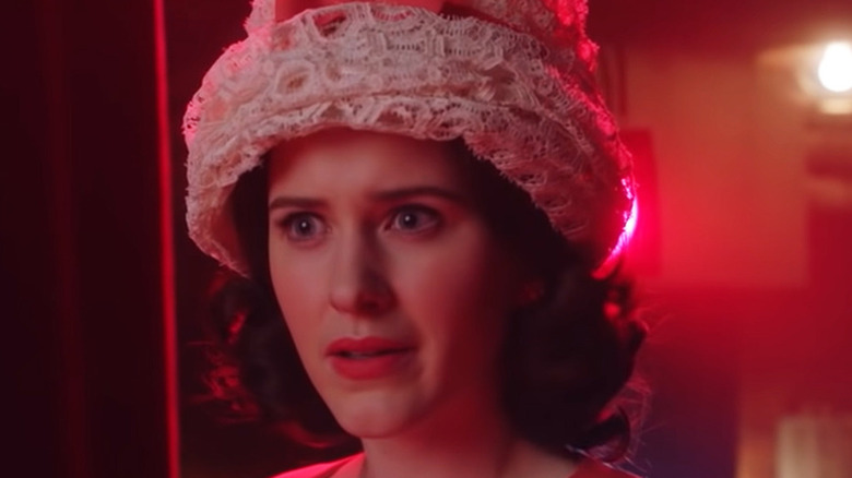 Midge Maisel wearing lacey hat